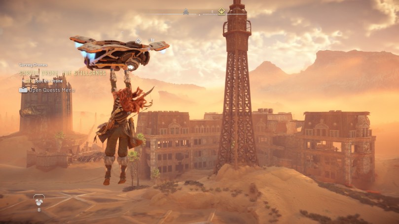 Aloy, after jumping on a Drone in the Las Vegas desert trying to weigh it down to loot it on the ground.