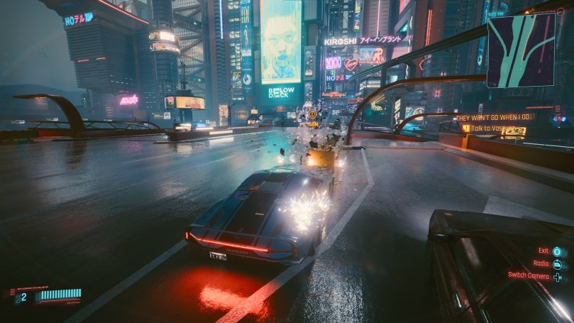 A view on Night City at night from the highway. The image aims to show the grainy screen space reflections produced by the games engine.