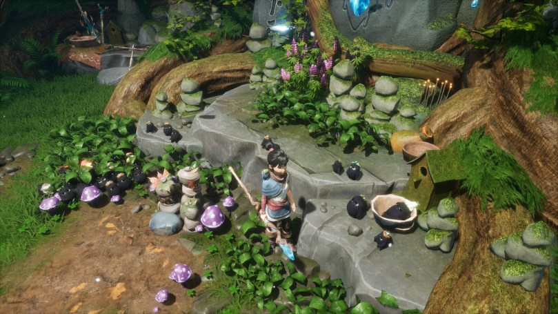 Kena standing next to a shrine where several of her Rot friends found places to sit and chill.