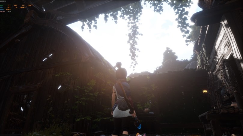 Kena looking at the sky from inside a crumbled hut. This images shows a low framerate in this situation.