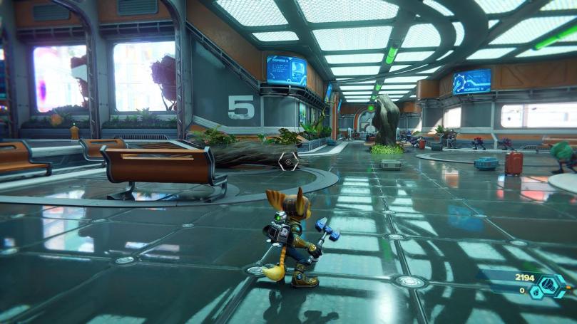 A screenshot showing the inside of something akin an futuristic airport with beautiful raytraced reflections on the floor.