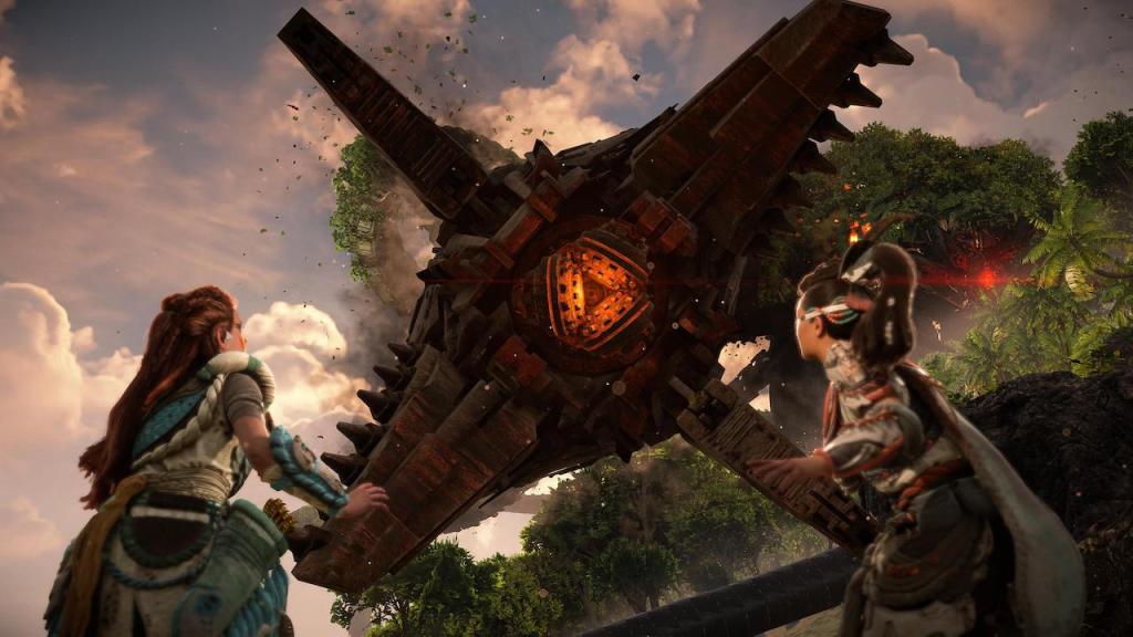 Aloy and Seyka looking up surprised and in fear at the Horus claw that is coming down on them.