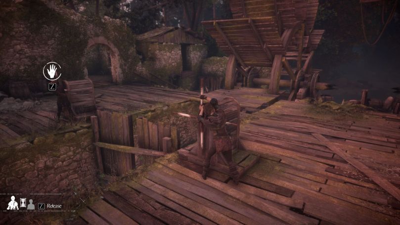 Amicia and Melie operating a puzzle in an abandoned water mill.